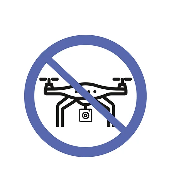 Simbolo di divieto di volo droni con icona di drone barrata in cerchio blu